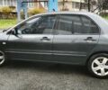 Сірий Міцубісі Lancer, об'ємом двигуна 1.58 л та пробігом 110 тис. км за 2999 $, фото 4 на Automoto.ua