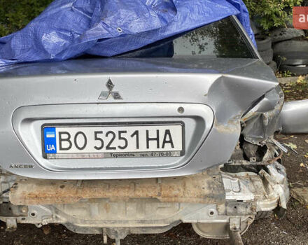 Сірий Міцубісі Lancer, об'ємом двигуна 1.58 л та пробігом 270 тис. км за 1999 $, фото 22 на Automoto.ua