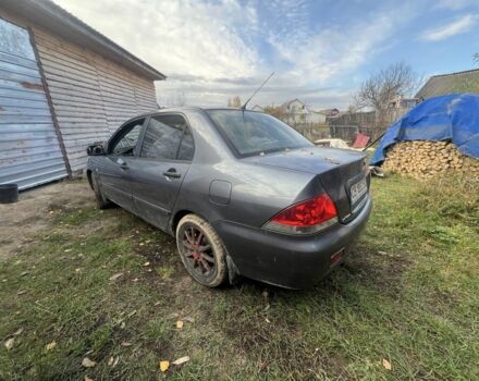 Серый Мицубиси Лансер, объемом двигателя 1.6 л и пробегом 200 тыс. км за 2400 $, фото 5 на Automoto.ua