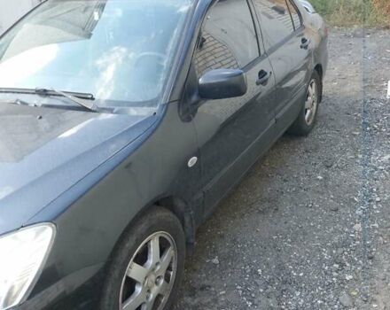 Сірий Міцубісі Lancer, об'ємом двигуна 1.58 л та пробігом 531 тис. км за 2828 $, фото 3 на Automoto.ua