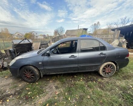 Серый Мицубиси Лансер, объемом двигателя 1.6 л и пробегом 200 тыс. км за 2400 $, фото 6 на Automoto.ua