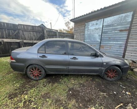 Серый Мицубиси Лансер, объемом двигателя 1.6 л и пробегом 200 тыс. км за 2400 $, фото 2 на Automoto.ua