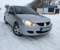 Сірий Міцубісі Lancer, об'ємом двигуна 0.13 л та пробігом 190 тис. км за 4250 $, фото 1 на Automoto.ua