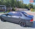 Сірий Міцубісі Lancer, об'ємом двигуна 1.59 л та пробігом 300 тис. км за 1999 $, фото 1 на Automoto.ua