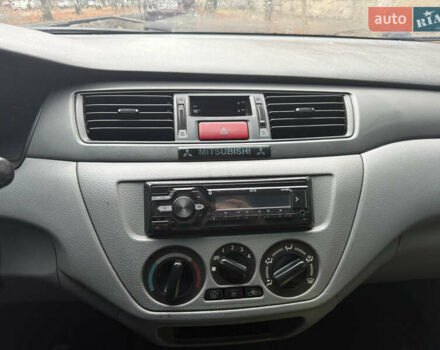 Серый Мицубиси Лансер, объемом двигателя 1.29 л и пробегом 263 тыс. км за 3400 $, фото 12 на Automoto.ua