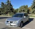 Серый Мицубиси Лансер, объемом двигателя 1.6 л и пробегом 299 тыс. км за 3999 $, фото 1 на Automoto.ua