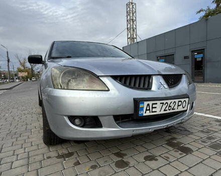 Серый Мицубиси Лансер, объемом двигателя 1.29 л и пробегом 263 тыс. км за 3400 $, фото 1 на Automoto.ua