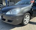 Сірий Міцубісі Lancer, об'ємом двигуна 1.58 л та пробігом 167 тис. км за 5100 $, фото 1 на Automoto.ua