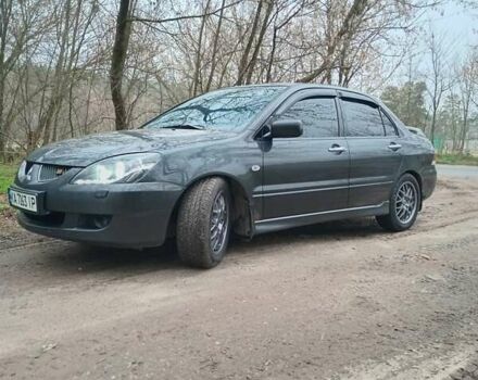 Сірий Міцубісі Lancer, об'ємом двигуна 1.58 л та пробігом 360 тис. км за 4000 $, фото 9 на Automoto.ua