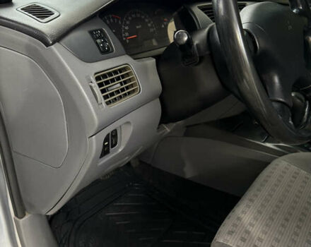 Серый Мицубиси Лансер, объемом двигателя 1.29 л и пробегом 263 тыс. км за 3400 $, фото 11 на Automoto.ua