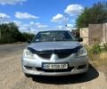 Серый Мицубиси Лансер, объемом двигателя 1.6 л и пробегом 385 тыс. км за 3499 $, фото 1 на Automoto.ua