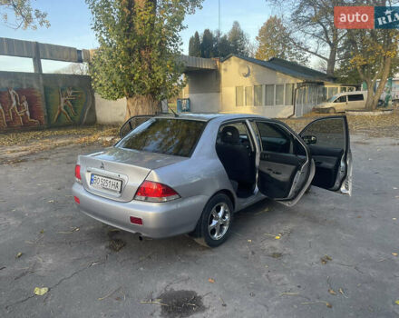 Сірий Міцубісі Lancer, об'ємом двигуна 1.58 л та пробігом 271 тис. км за 3000 $, фото 17 на Automoto.ua