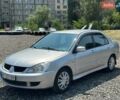 Серый Мицубиси Лансер, объемом двигателя 1.58 л и пробегом 274 тыс. км за 2850 $, фото 1 на Automoto.ua