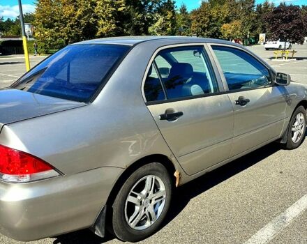 Серый Мицубиси Лансер, объемом двигателя 1.3 л и пробегом 245 тыс. км за 3000 $, фото 11 на Automoto.ua