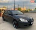 Серый Мицубиси Лансер, объемом двигателя 1.59 л и пробегом 283 тыс. км за 1999 $, фото 1 на Automoto.ua