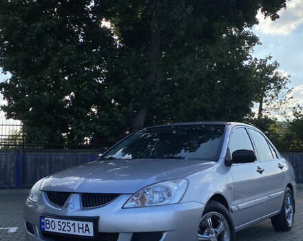 Сірий Міцубісі Lancer, об'ємом двигуна 1.58 л та пробігом 270 тис. км за 1999 $, фото 1 на Automoto.ua