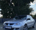 Сірий Міцубісі Lancer, об'ємом двигуна 1.58 л та пробігом 270 тис. км за 1999 $, фото 1 на Automoto.ua