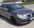 Сірий Міцубісі Lancer, об'ємом двигуна 0.16 л та пробігом 298 тис. км за 3900 $, фото 1 на Automoto.ua