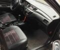 Серый Мицубиси Лансер, объемом двигателя 1.6 л и пробегом 345 тыс. км за 5000 $, фото 4 на Automoto.ua