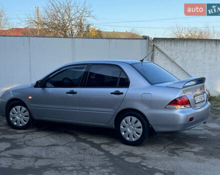 Серый Мицубиси Лансер, объемом двигателя 1.6 л и пробегом 320 тыс. км за 3650 $, фото 24 на Automoto.ua