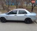 Серый Мицубиси Лансер, объемом двигателя 1.3 л и пробегом 230 тыс. км за 3900 $, фото 1 на Automoto.ua