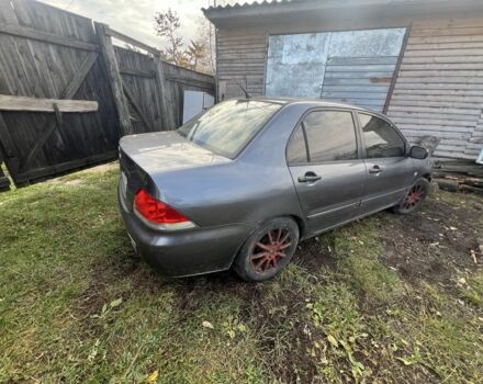 Серый Мицубиси Лансер, объемом двигателя 1.6 л и пробегом 200 тыс. км за 2400 $, фото 3 на Automoto.ua