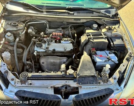 Серый Мицубиси Лансер, объемом двигателя 1.3 л и пробегом 245 тыс. км за 3000 $, фото 8 на Automoto.ua