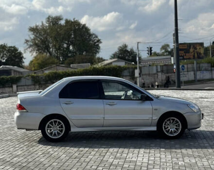 Сірий Міцубісі Lancer, об'ємом двигуна 1.6 л та пробігом 260 тис. км за 3899 $, фото 5 на Automoto.ua