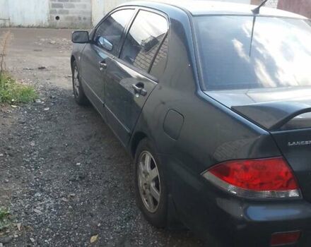 Сірий Міцубісі Lancer, об'ємом двигуна 1.58 л та пробігом 531 тис. км за 2828 $, фото 9 на Automoto.ua
