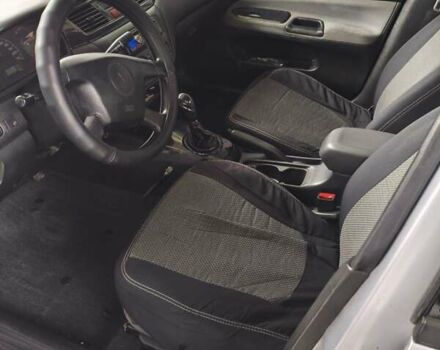 Сірий Міцубісі Lancer, об'ємом двигуна 1.58 л та пробігом 320 тис. км за 3700 $, фото 9 на Automoto.ua