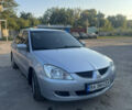 Сірий Міцубісі Lancer, об'ємом двигуна 1.58 л та пробігом 220 тис. км за 4400 $, фото 4 на Automoto.ua