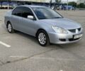 Сірий Міцубісі Lancer, об'ємом двигуна 1.6 л та пробігом 285 тис. км за 4450 $, фото 1 на Automoto.ua