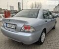 Сірий Міцубісі Lancer, об'ємом двигуна 1.3 л та пробігом 210 тис. км за 4400 $, фото 9 на Automoto.ua