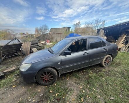 Серый Мицубиси Лансер, объемом двигателя 1.6 л и пробегом 200 тыс. км за 2400 $, фото 7 на Automoto.ua