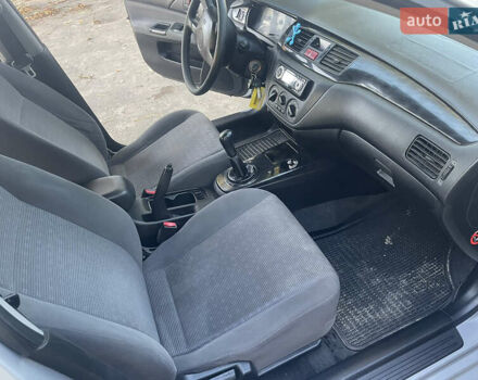 Сірий Міцубісі Lancer, об'ємом двигуна 1.58 л та пробігом 271 тис. км за 3000 $, фото 25 на Automoto.ua