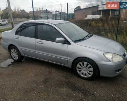 Міцубісі Lancer 2004 у Харкові на Automoto.ua Сірий Міцубісі Lancer, об'ємом двигуна 1.58 л та пробігом 248 тис. км за 3550 $, фото 11 на Automoto.ua