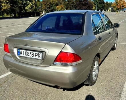 Серый Мицубиси Лансер, объемом двигателя 1.3 л и пробегом 245 тыс. км за 3000 $, фото 2 на Automoto.ua