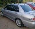 Сірий Міцубісі Lancer, об'ємом двигуна 2 л та пробігом 304 тис. км за 5000 $, фото 3 на Automoto.ua