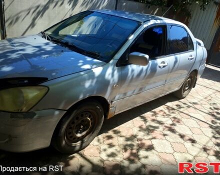 Серый Мицубиси Лансер, объемом двигателя 1.6 л и пробегом 308 тыс. км за 3500 $, фото 10 на Automoto.ua