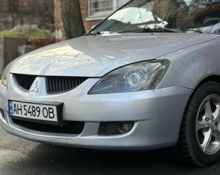 Серый Мицубиси Лансер, объемом двигателя 2 л и пробегом 180 тыс. км за 3700 $, фото 1 на Automoto.ua