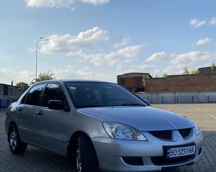 Сірий Міцубісі Lancer, об'ємом двигуна 1.58 л та пробігом 270 тис. км за 1999 $, фото 7 на Automoto.ua