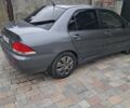 Сірий Міцубісі Lancer, об'ємом двигуна 1.58 л та пробігом 290 тис. км за 3900 $, фото 2 на Automoto.ua