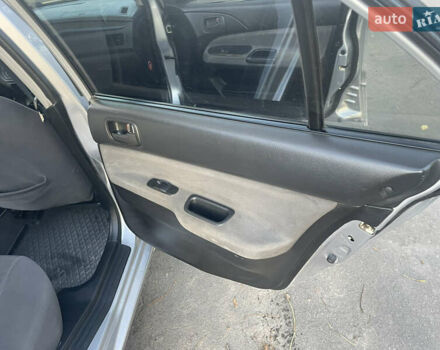 Сірий Міцубісі Lancer, об'ємом двигуна 1.58 л та пробігом 271 тис. км за 3000 $, фото 26 на Automoto.ua