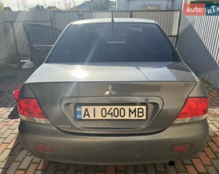 Сірий Міцубісі Lancer, об'ємом двигуна 1.58 л та пробігом 262 тис. км за 3900 $, фото 1 на Automoto.ua
