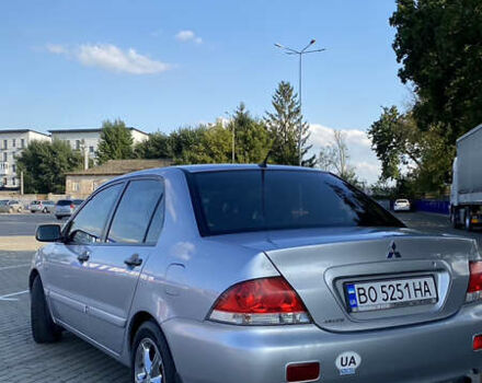 Сірий Міцубісі Lancer, об'ємом двигуна 1.58 л та пробігом 270 тис. км за 1999 $, фото 4 на Automoto.ua