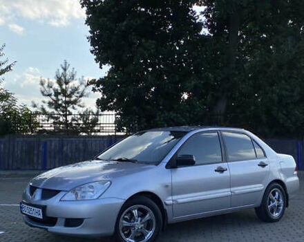 Сірий Міцубісі Lancer, об'ємом двигуна 1.58 л та пробігом 270 тис. км за 1999 $, фото 3 на Automoto.ua