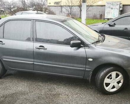 Сірий Міцубісі Lancer, об'ємом двигуна 1.58 л та пробігом 110 тис. км за 2999 $, фото 5 на Automoto.ua