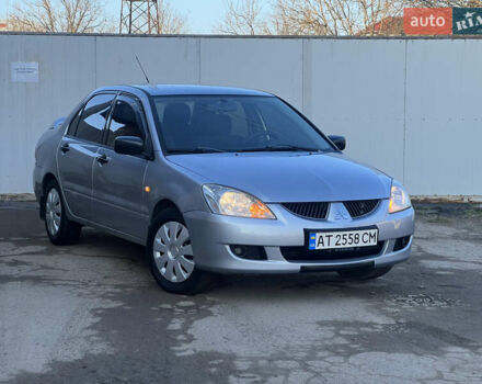 Серый Мицубиси Лансер, объемом двигателя 1.6 л и пробегом 320 тыс. км за 3650 $, фото 1 на Automoto.ua