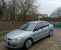 Сірий Міцубісі Lancer, об'ємом двигуна 1.58 л та пробігом 439 тис. км за 2500 $, фото 1 на Automoto.ua