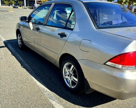 Серый Мицубиси Лансер, объемом двигателя 1.3 л и пробегом 245 тыс. км за 3000 $, фото 3 на Automoto.ua